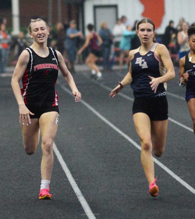 Forreston-Polo's Autum Pritchard (left) races Elgin Harvest Christian's Emma Leslie to the finish line in the 400 meters at the 1A Winnebago Sectional on Friday, May 12.