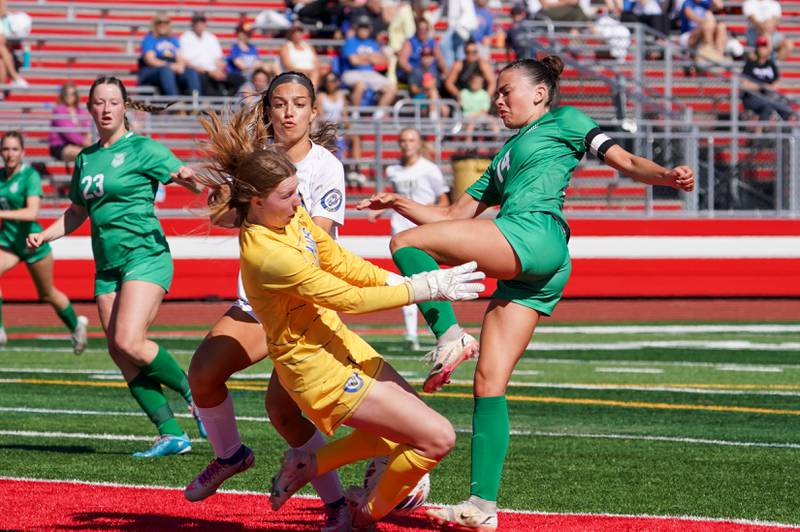 Lyons’ Anna Bigenwald (0) defends against a shot attempt by York’s Michaela Quinn (14) during a Class 3A Hinsdale Central Sectional girls soccer championship match at Hinsdale Central High School on Saturday, May 25, 2024.