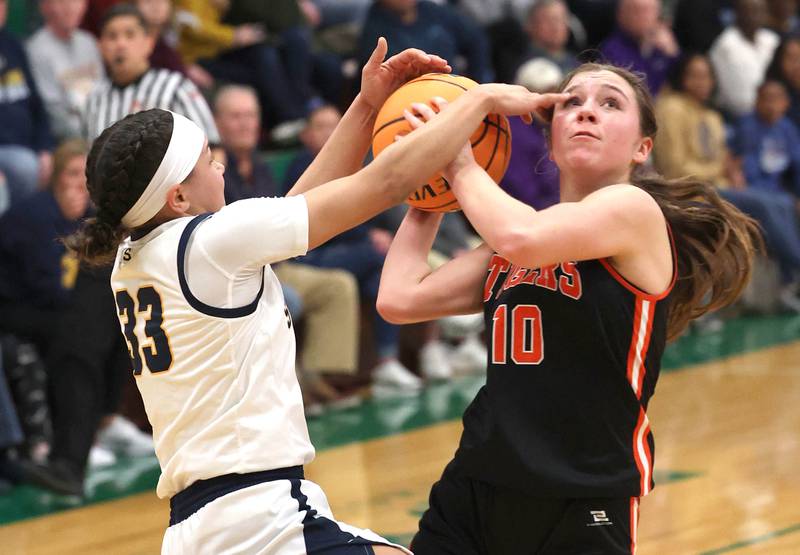 Crystal Lake Central's Sammi Pottorff is fouled by Sterling's Joslynn James during their Class 3A sectional semifinal game Tuesday, Feb. 25, 2025, at Boylan Catholic High School in Rockford.