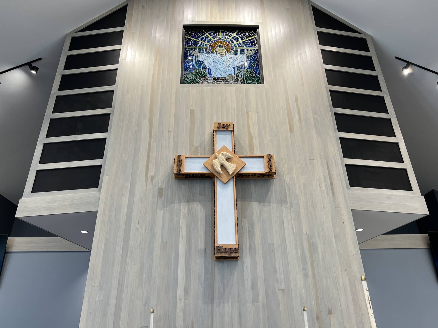 The cross hanging at the front of First United Methodist Church's new worship was created from old church pews by a member of the congregation. Photo taken Aug. 4, 2023.