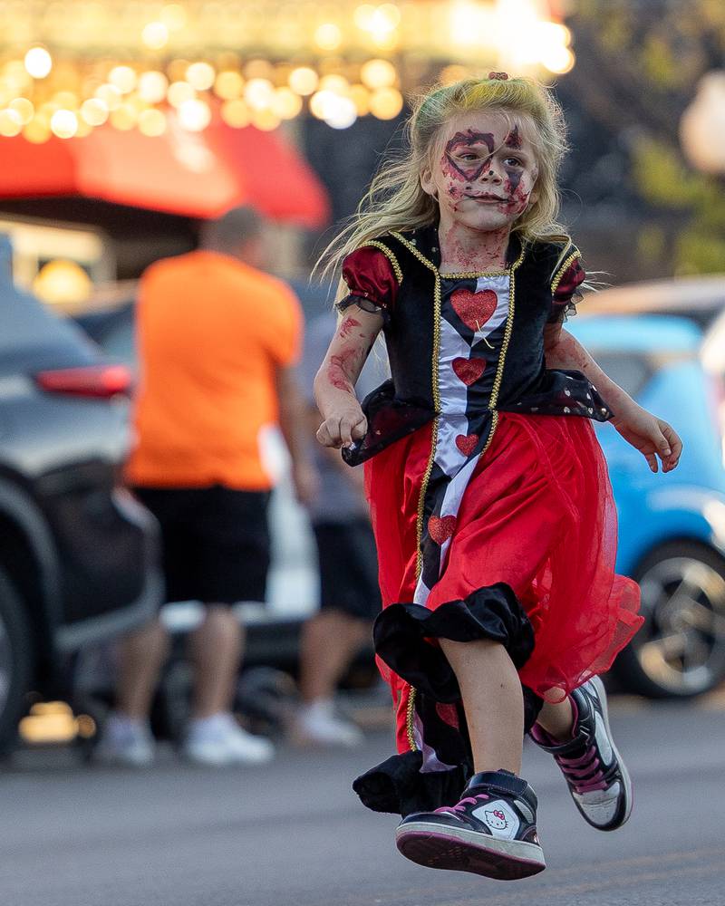 Child skips whilst in the annual Princeton Halloween Parade procession on Saturday, Oct. 4, 2025 on Main Street in Princeton.