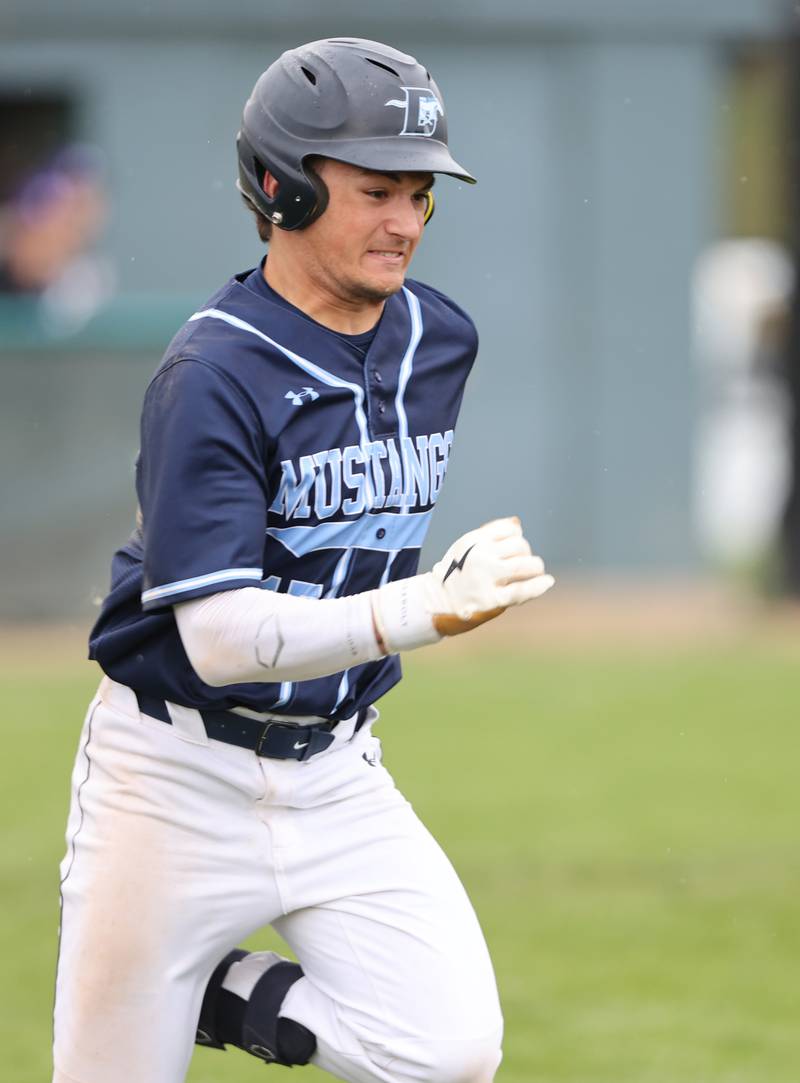 Downers Grove South's Anthony Titone (15) runs to first during the varsity baseball game between Downers Grove South and Downers Grove North in Downers Grove on Saturday, April 29, 2023.