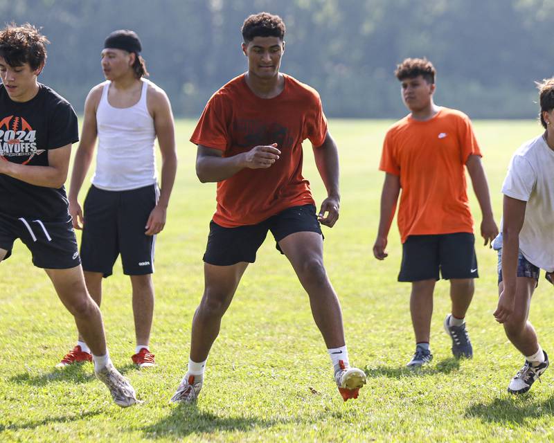Dylan Johnson (center) works through speed drills during Sandwich football practice Tuesday, July 22, 2025 in Sandwich.