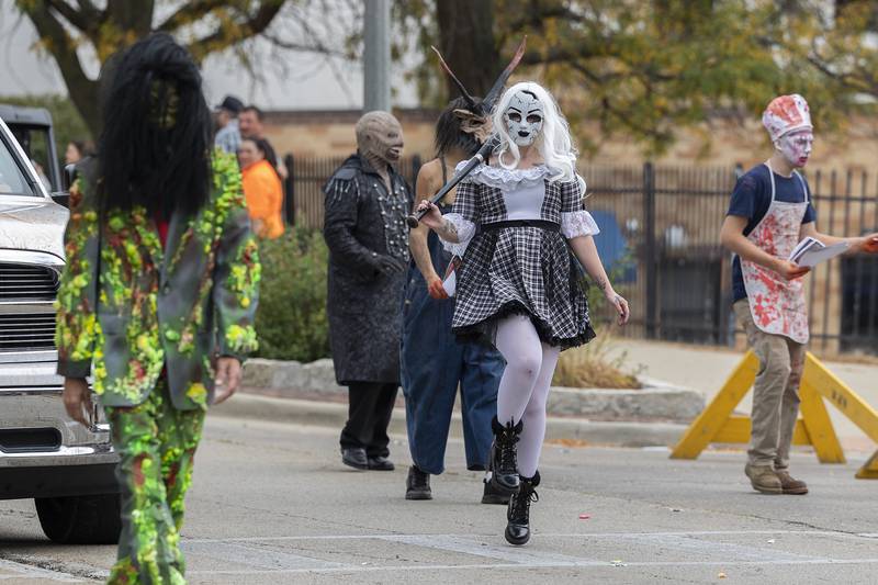 Eerie characters greet parade goers in the Fiesta Parade Saturday, Sept. 20, 2025 in Sterling. Two local haunted houses spooked and scared parade goers with their ghastly fun.