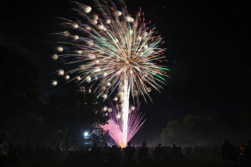 Spectators watch the grand finale of the city of Kankakee's fireworks show at Kankakee Community College on Friday, July 4, 2025.