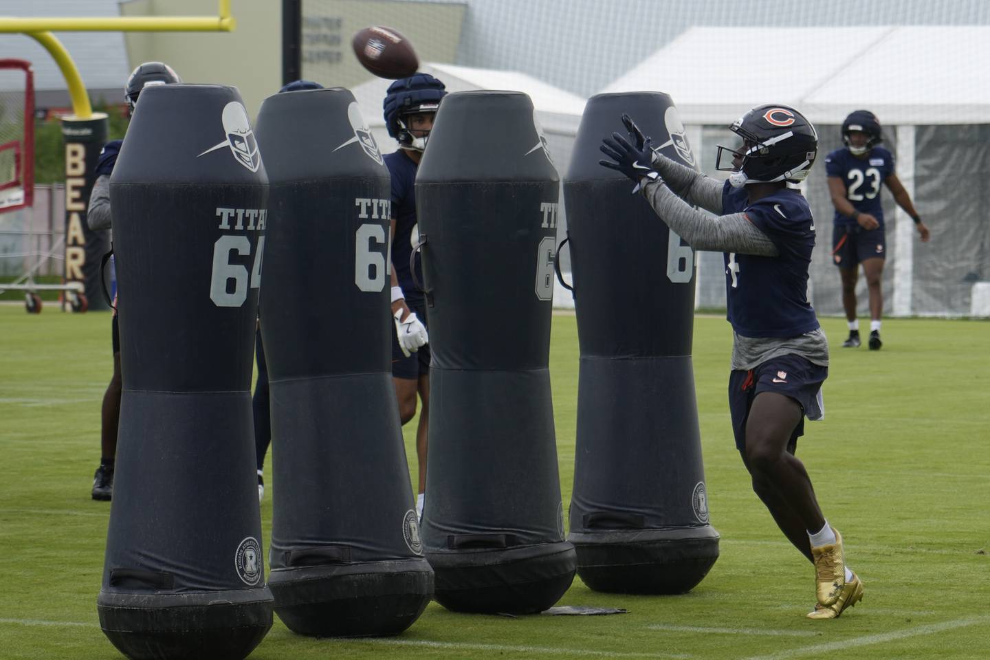 Chicago Bears wide receiver Olamide Zaccheaus (14) practices during Back Together training camp event for fans on Saturday, July 26, 2025, in Lake Forest, Ill. Chicago. (AP Photo/David Banks)