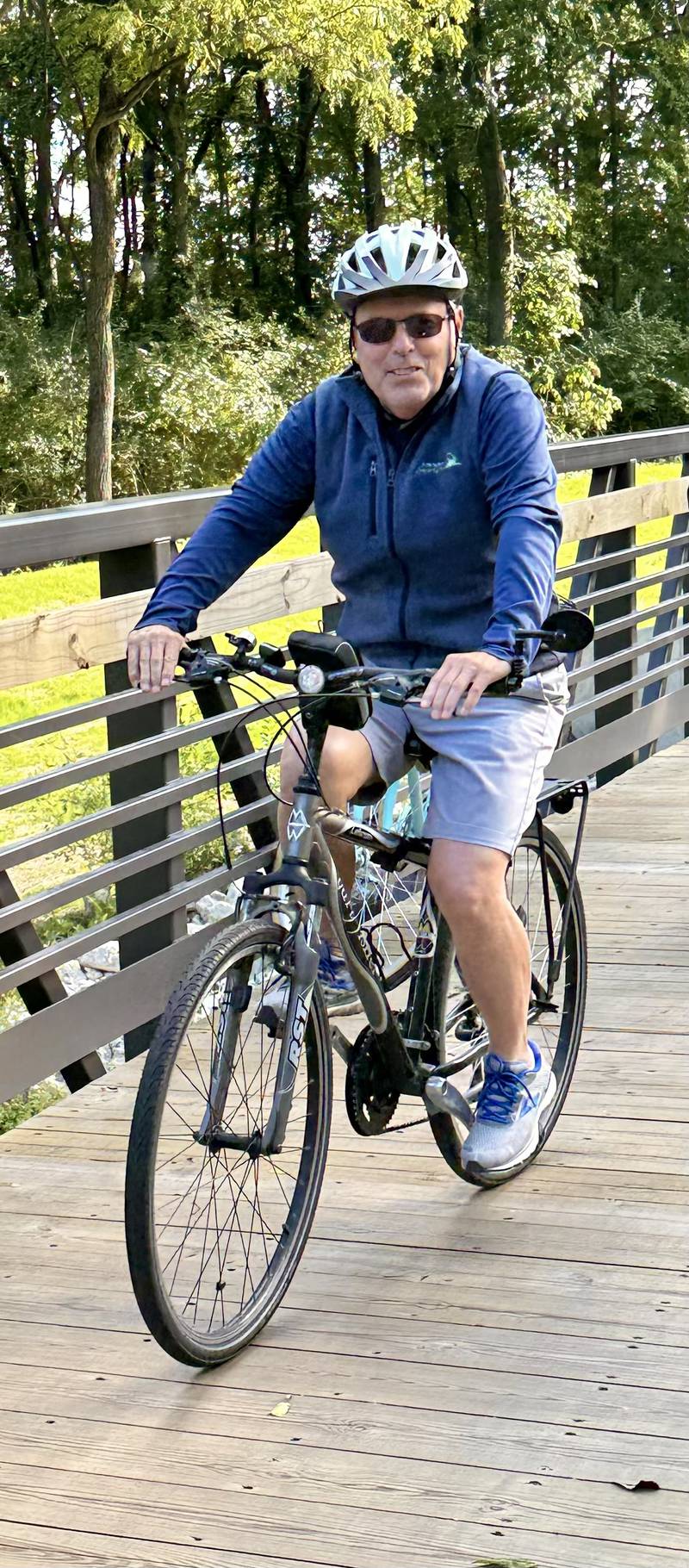 Township of Sugar Grove Supervisor Tom Rowe participates in a community bike ride during a ribbon cutting for the Bridge at Belle Vue Park on Sept. 5, 2025, in Sugar Grove.