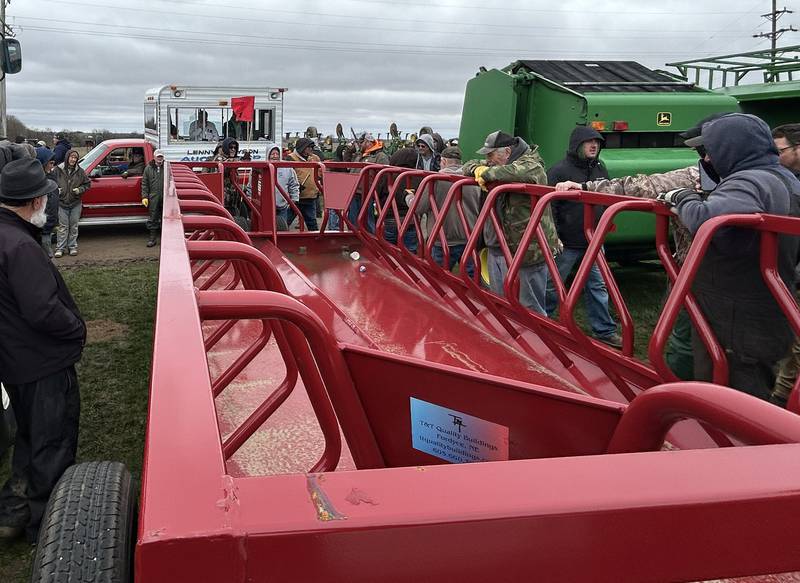 A hay feeder wagon is auctioned off by Lenny Bryson at the Spring Hazelhurst Consignment Sale on Saturday, April 4, 2026.