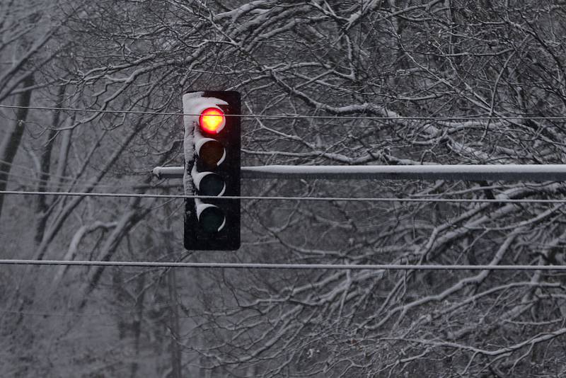 Snow covers a traffic signal at the intersection of Route 12, and Johnsburg Road on Jan. 25, 2023, after snow fell throughout the morning.