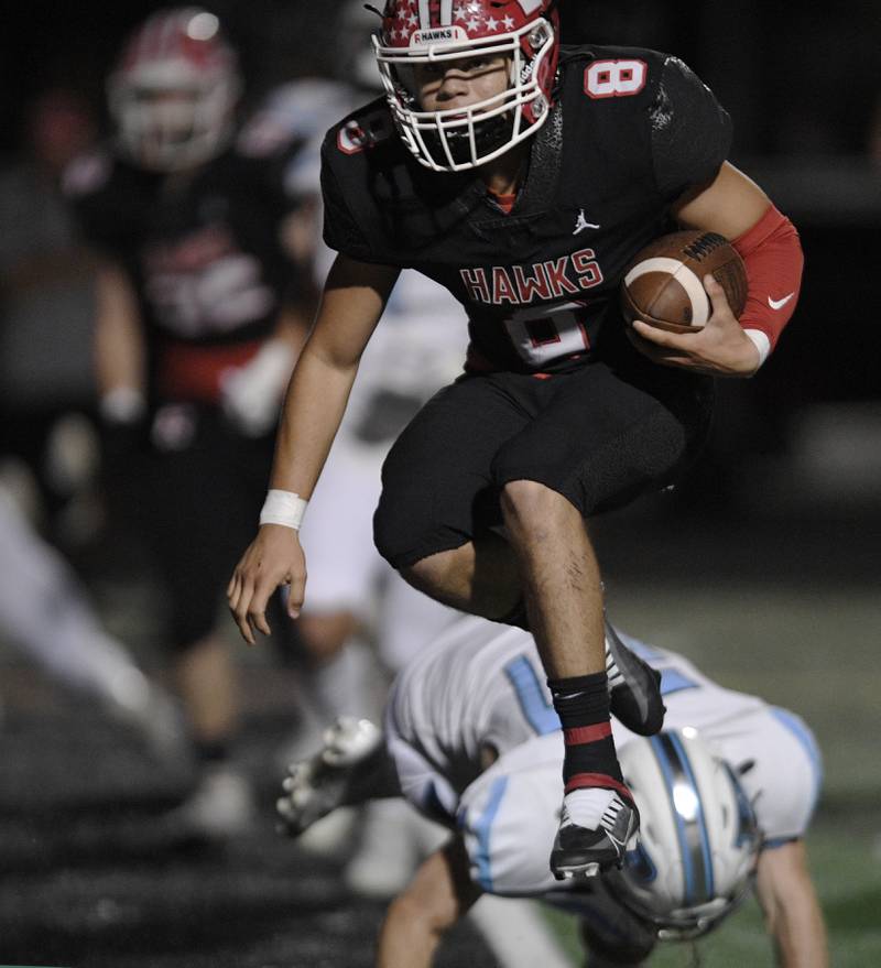 Maine South quarterback Jack Defilippis skips over the goal line for the first score against Prospect in a Thursday night football game in Park Ridge on September 15, 2022.