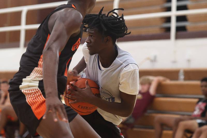 Joliet Central’s Deven Triplett collides with a DeKalb players while trying to control the ball at the 37th Morris Boys Shootout on Tuesday, June 25, 2024.
