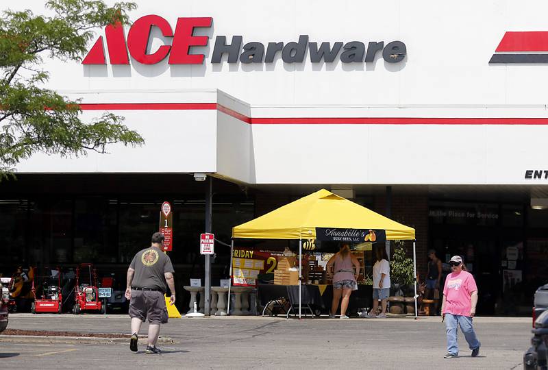 People shop at a Pop Up Market outside of the Laskowski ACE Hardware store, in McHenry, on Friday, Aug.15, 2025, during McHenry.’ 815 Day.