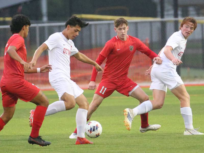 L-P's Brayan Gonzalez, Ottawa's Jorge Lopez, L-P's Jason Curran Jr. and Ottawa's Evan Snook compete to get the ball on Monday, Sept. 11, 2023 at the L-P Athletic Complex in La Salle.