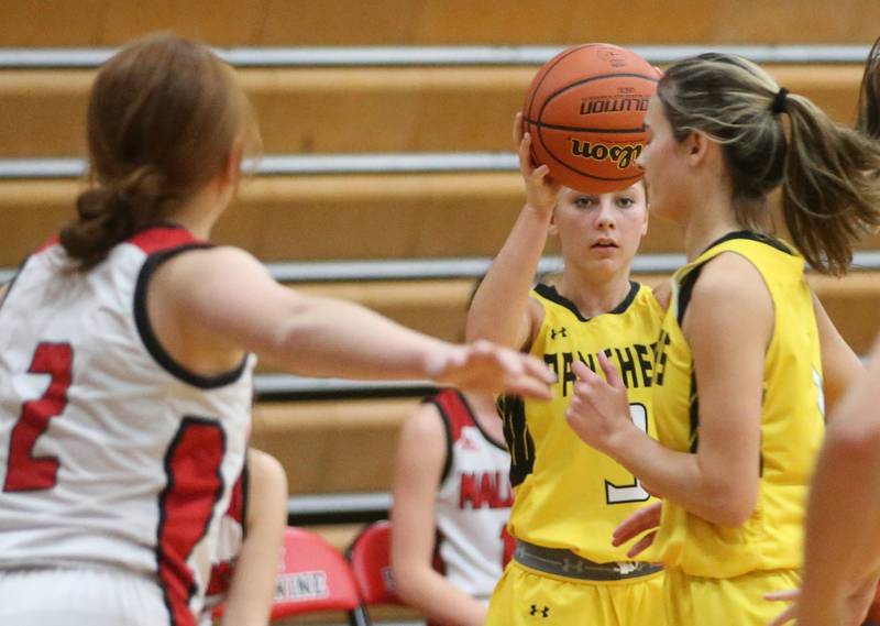 Putnam County's Gabby Doyle looks to pass against Henry-Senachwine on Monday, Dec. 18, 2023 in Henry.