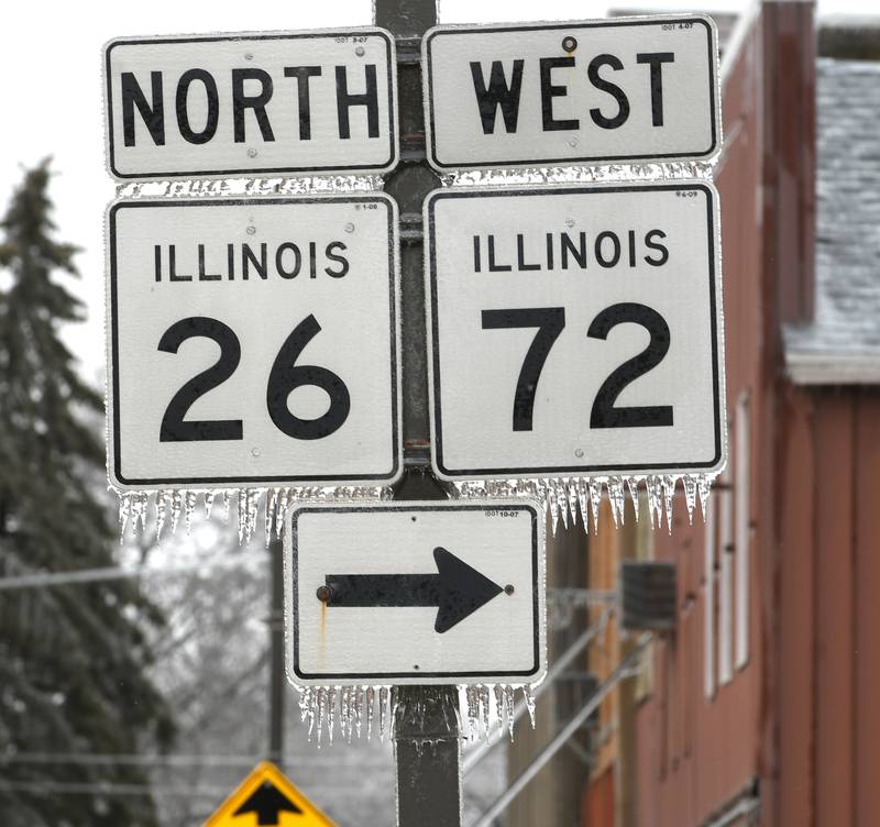 An ice storm, coupled with strong winds, caused numerous electrical outages in Forreston on Thursday. Here, ice covers a sign in downtown on Thursday afternoon.