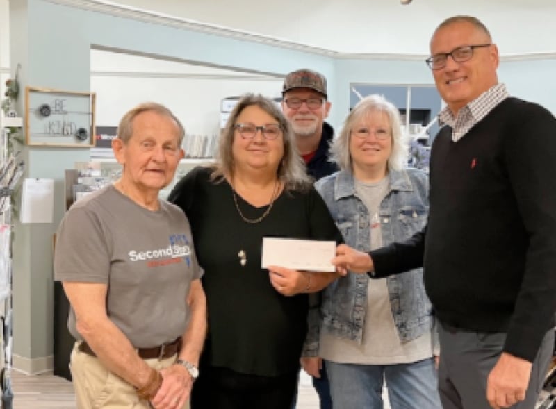 (From left) Don J. Schiff, Julie Grady, Jeff VanAutreve, Dana VanAutreve and Rick Clary stand in for a $10,000 donation from Central Bank of Princeton to Second Story Teen Center.