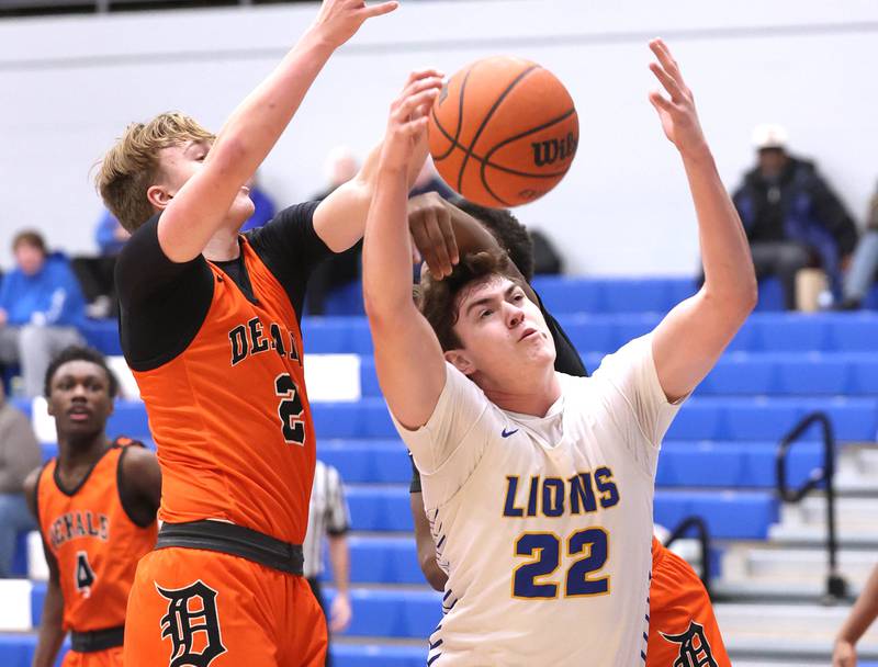 Lyons Township's Brady Chambers and DeKalb’s Sean Reynolds go after a rebound Monday, Jan. 15, 2023, during their game in the Burlington Central Martin Luther King Jr. boys basketball tournament.