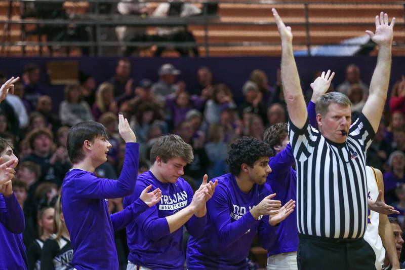 The Downers North bench cheers as the referee signals a three pointer during their basketball game between Glenbard West at Downers Grove North. Jan 24, 2025 in Downers Grove.