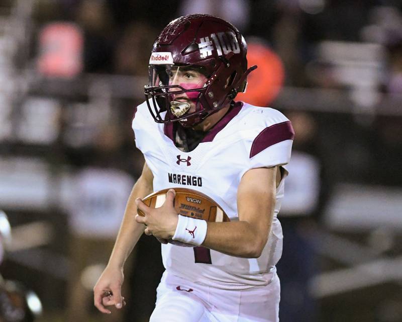 Marengo's quarterback David Lopez (1) runs the ball for a 74-yard touchdown during the game on Friday Oct. 25, 2024, while traveling to take on Sandwich High School.