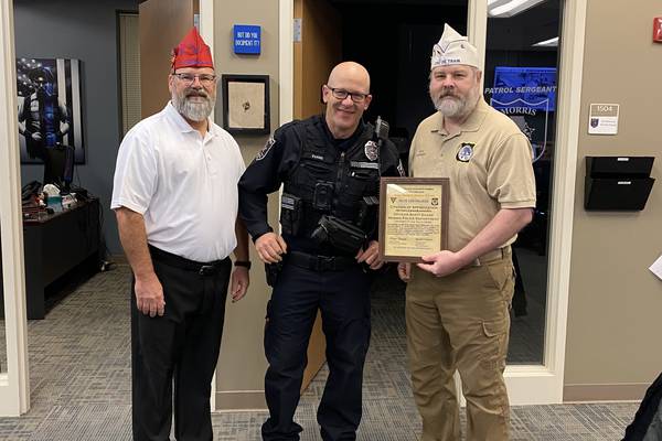 40&8 Blue Chevaliers give Morris Officer Evans a citation of appreciation