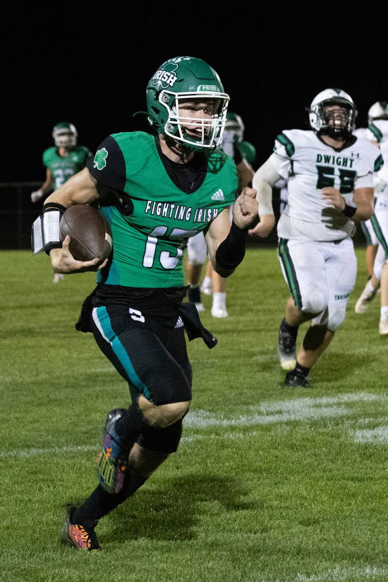 Seneca's quarterback Paxton Giertz (15) runs the ball downfield Friday, Oct. 4, 2024, against Dwight/Gardner-South Wilmington at Seneca High School.