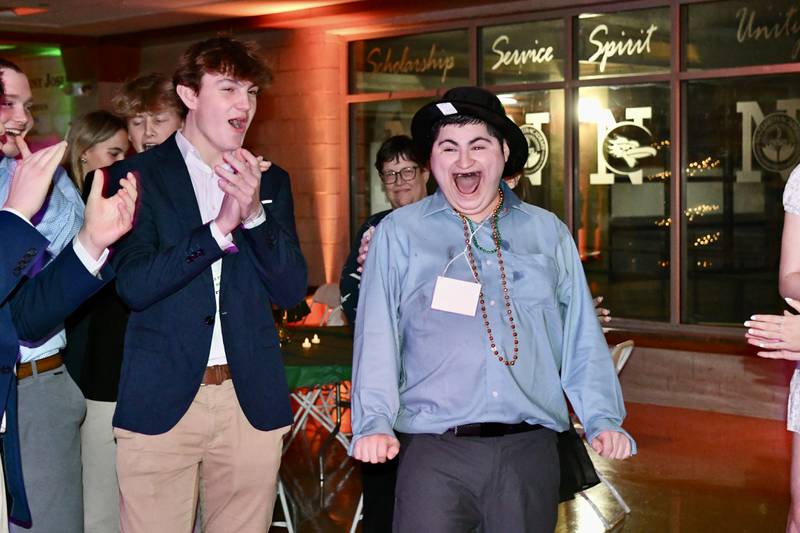 Frankie Nichols cheers as Alec is crowned FISH Prom King during the 7th FISH Prom for Teens with Disabilities on Saturday, March 8, 2025 at Nazareth Academy in La Grange Park.