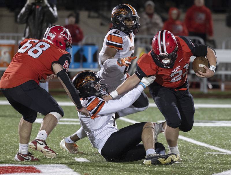 Millegeville’s Konner Johnson hails down Amboy’s Quinn Leffelman Friday, Nov. 22, 2024, during the 8-man football championship in Monmouth.