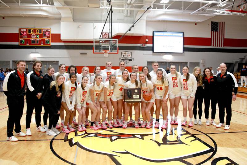 Batavia players celebrate their Class 4A Batavia Sectional final win over Geneva on Thursday, Feb. 22, 2024.
