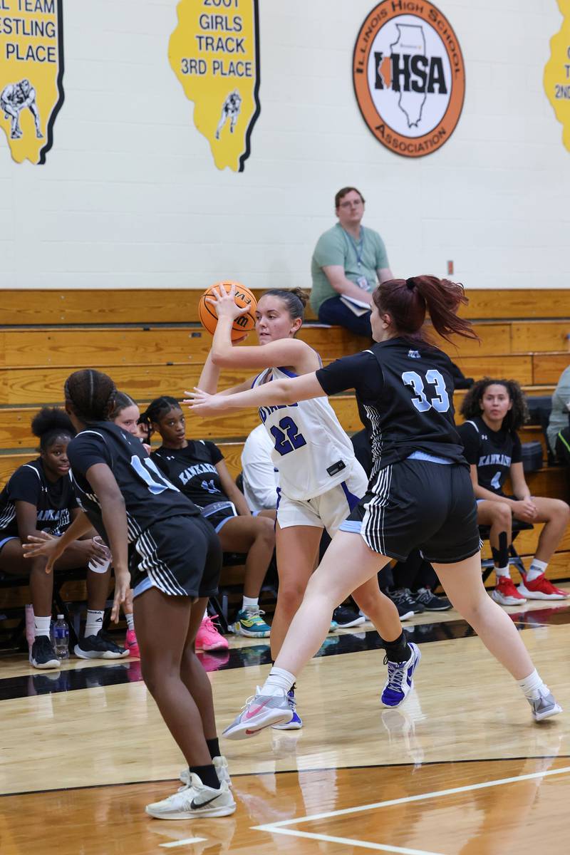 Rosary's Kayla Shimp looks to pass under pressure from Kankakee's Kenyatta Deal during the Kays' 75-28 victory over Rosary at the Reed-Custer Classic on Monday, Nov. 17, 2025.