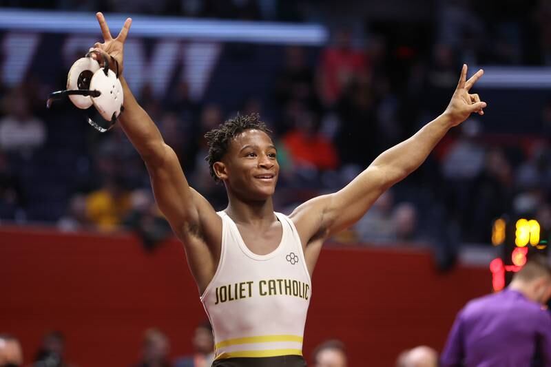 Joliet Catholic’s Gylon Sims celebrates his victory over Rochelle’s Xavier Villalobos in the Class 2A 113lb. championship match at State Farm Center in Champaign. Saturday, Feb. 19, 2022, in Champaign.