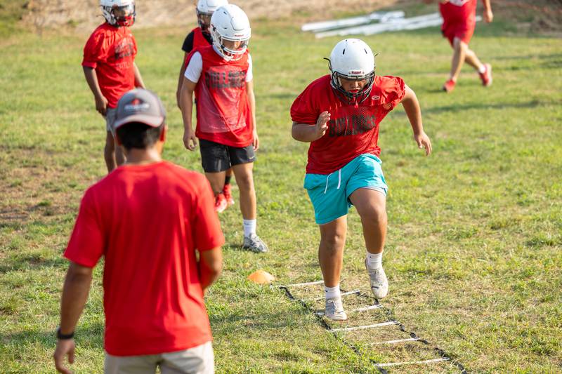 Alaris Luciano of Streator runs over hurdles during drill at practice on Monday, August 11, 2025 at Streator High School in Streator.