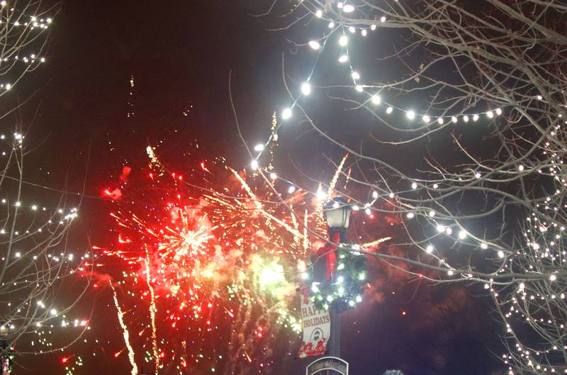 Fireworks explode over downtown Huntley during A Very Merry Huntley on Saturday, Dec. 6, 2025.