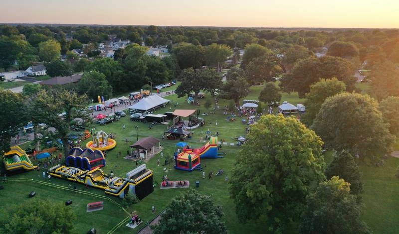 The sun sets over the Taste of the Illinois Valley festival on Saturday, Aug. 3, 2024 at Centennial Park in Peru.