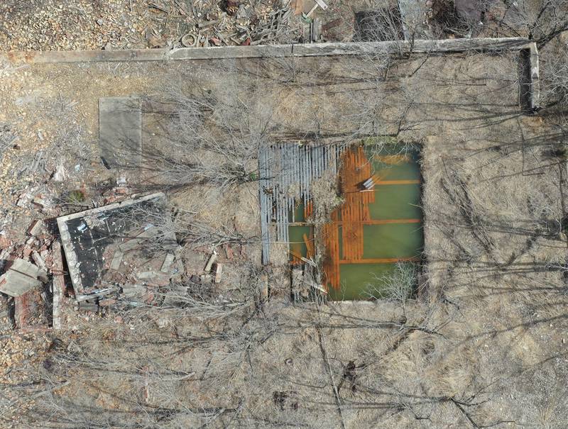 An aerial view of a rusty pond from the ruins of the Matthiessen and Hegeler Zinc Co. can be seen just to the north of the Carus Chemical Plant on Tuesday, April 10, 2023 in La Salle. M&H Zinc operated a zinc smelter on the industrial portion of the site from 1858 until 1961.From 1858 until 1978, the site primarily housed a zinc smelting and rolling facility. La Salle Rolling Mills continued operations on the site until the firm’s bankruptcy in 2001. EPA placed the site on the Superfund program’s National Priorities List (NPL) in 2003. The Superfrund site is 160-acres.