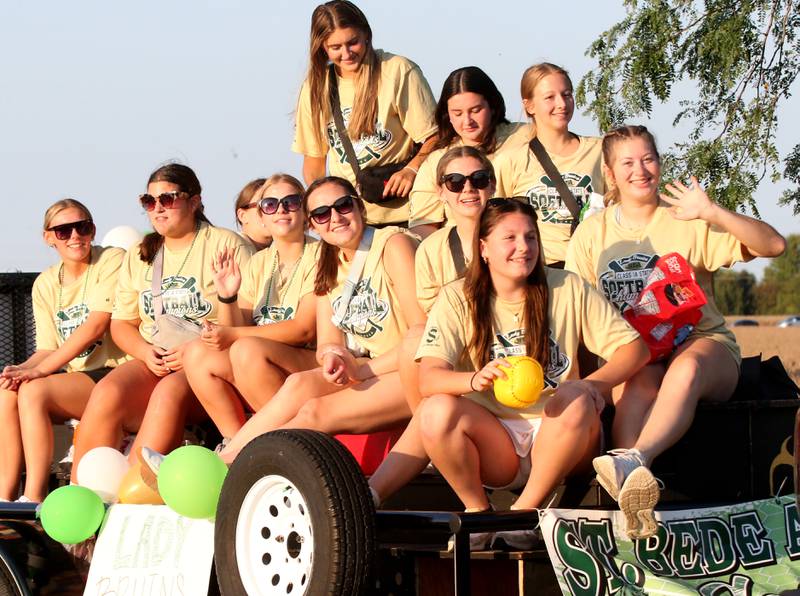 Members of the Lady Bruin softball team ride in the St. Bede Homecoming Parade on Friday, Sept. 29, 2023 at St. Bede Lane.
