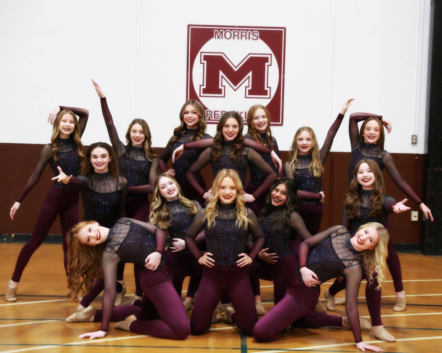 Team members are Alexa Edwards, Maddi Pilch, Maddy Rushing, Sienna Cleek, Michaela Harlan, Myah Butler, Caelyn Goffinet, Gracie Nelson, Gracie Mennenga, Brenna Mills, Ashlyn Punke, Maya Price, Macy Shell and Sammie Tully.