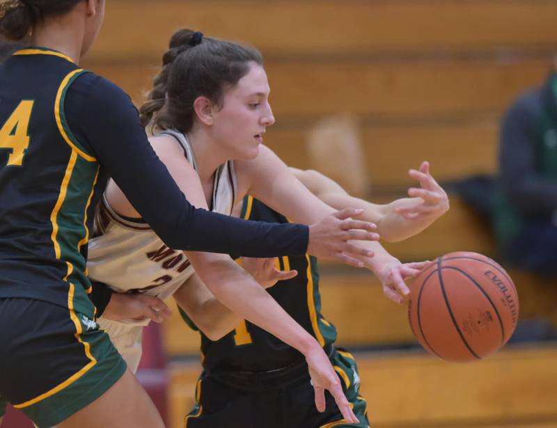 Montini’s Shea Carver loses the ball under pressure from Fremd’s Kace Urlacher and Sam Bodensteiner in a girls basketball game in Lombard on Monday, January 23, 2023.