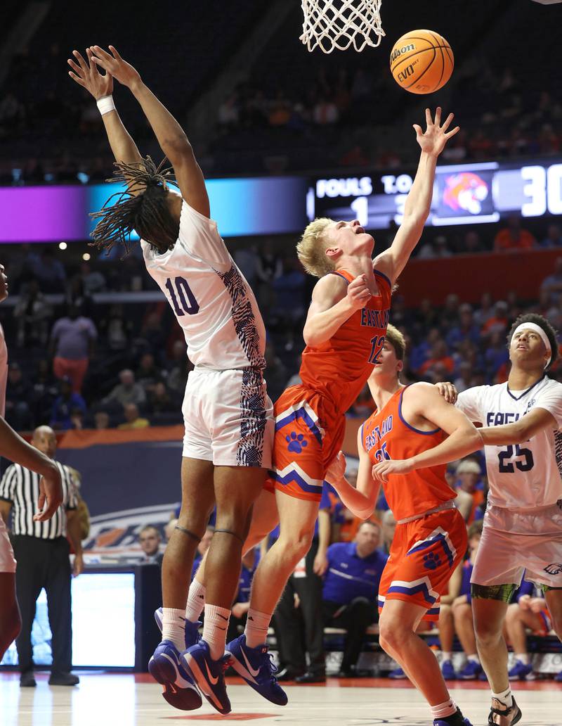 Eastland's Adam Awender gets a layup in front of Chicago Hope Academy's Trentyn McGinnis during their IHSA Class 1A state championship game Saturday, March 15, 2025, in the State Farm Center at the University of Illinois in Champaign.
