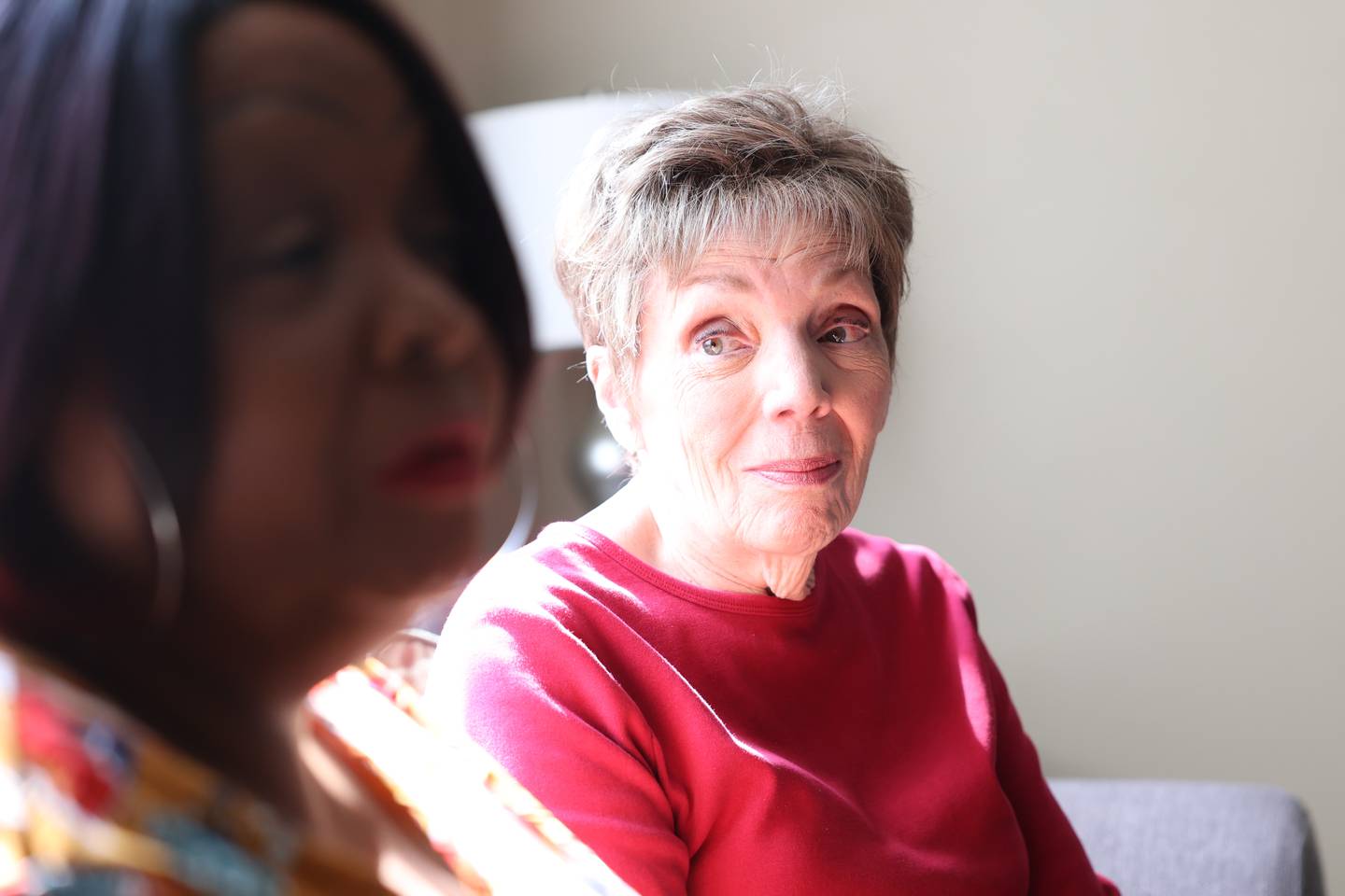 Senior Companion volunteer Karen Stromberger, right, listens to Josephine Simmons, right, listens to share about the program. Catholic Charities Senior Companion Program offers adults age 55 and older the opportunity to support and interact with their homebound peers. Wednesday, April 27, 2022, in Crest Hill.