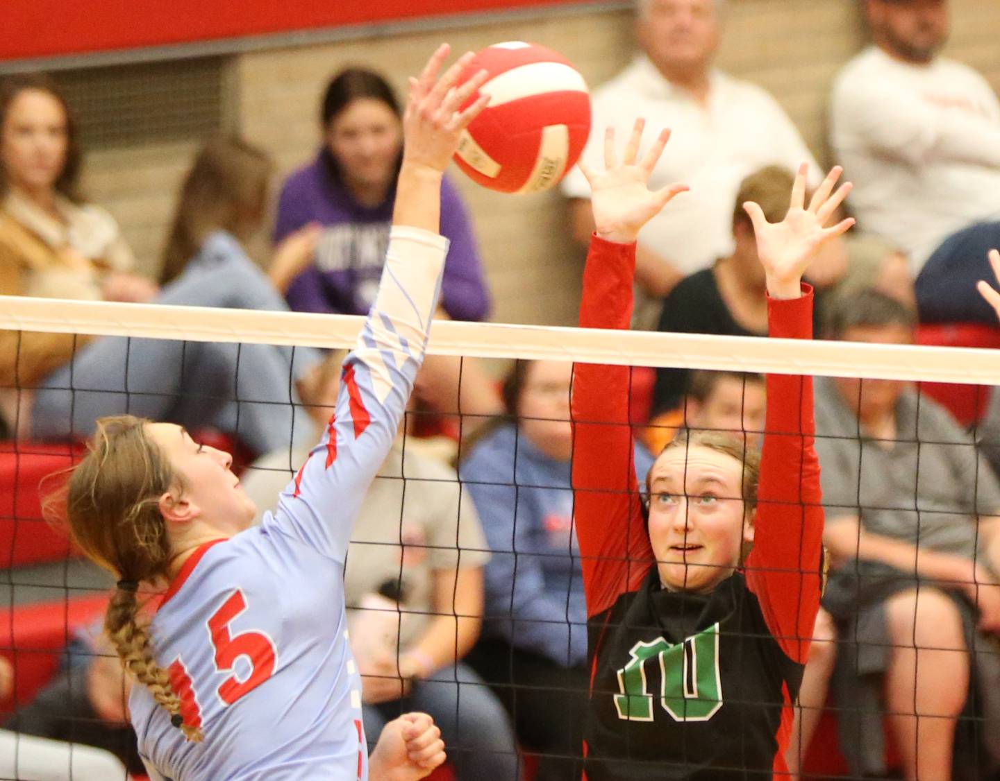Ottawa's Addison Duggan hits a spike past L-P's Katie Sowers on Thursday, Sept. 21, 2023 at Kingman Gym.