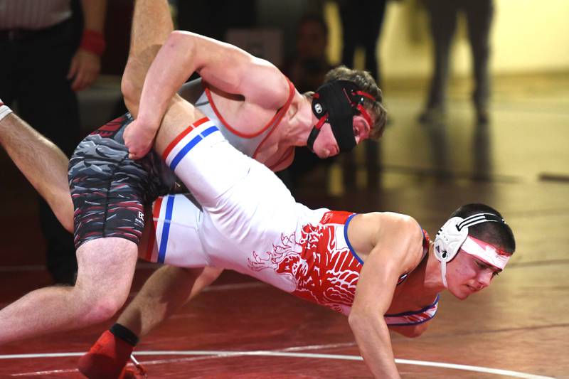 Fulton's Wiley Blasdell (top) takes Oregon's Cole Suter to the mat during their 165 pound match at a triangular meet with Polo at Oregon High School on Thursday, Dec. 4, 2025.
