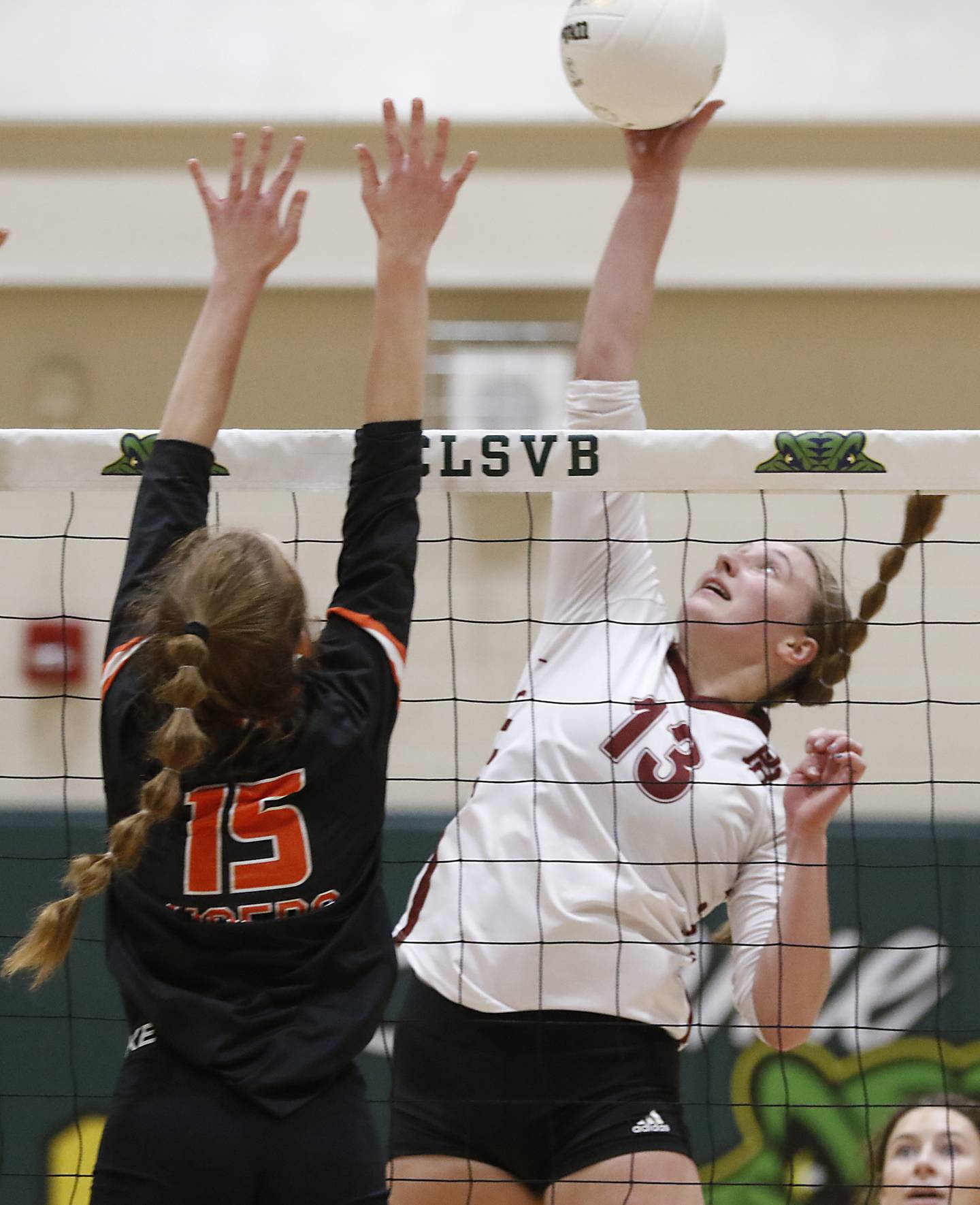 Prairie Ridge's Katya Flaugher, right, hits the ball past Crystal Lake Central's Gabbie Anderson, left, during a IHSA Class 3A regional volleyball match Thursday, Oct. 27, 2022, between Prairie Ridge and Crystal Lake Central at Crystal Lake South High School.