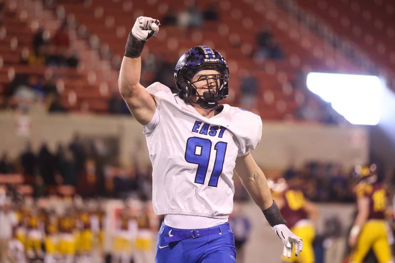 Lincoln-Way East’s Caden O’Rouke celebrates forcing a turnover on downs against Loyola in the Class 8A championship on Saturday, Nov. 25, 2023 at Hancock Stadium in Normal.
