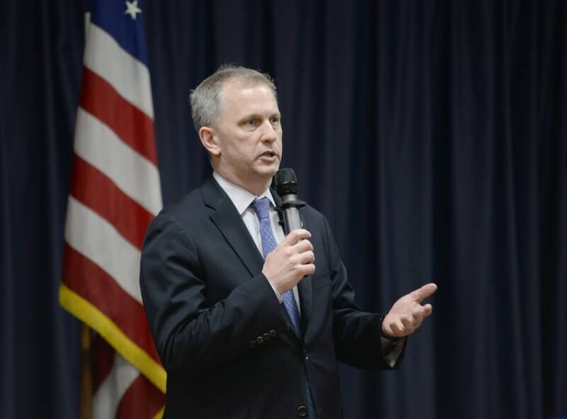 United States Representative Sean Casten addresses  people who attend the Downers Grove Town Hall stating virtue is his response to the crisis overseas and in America Wednesday March 19, 2025.
