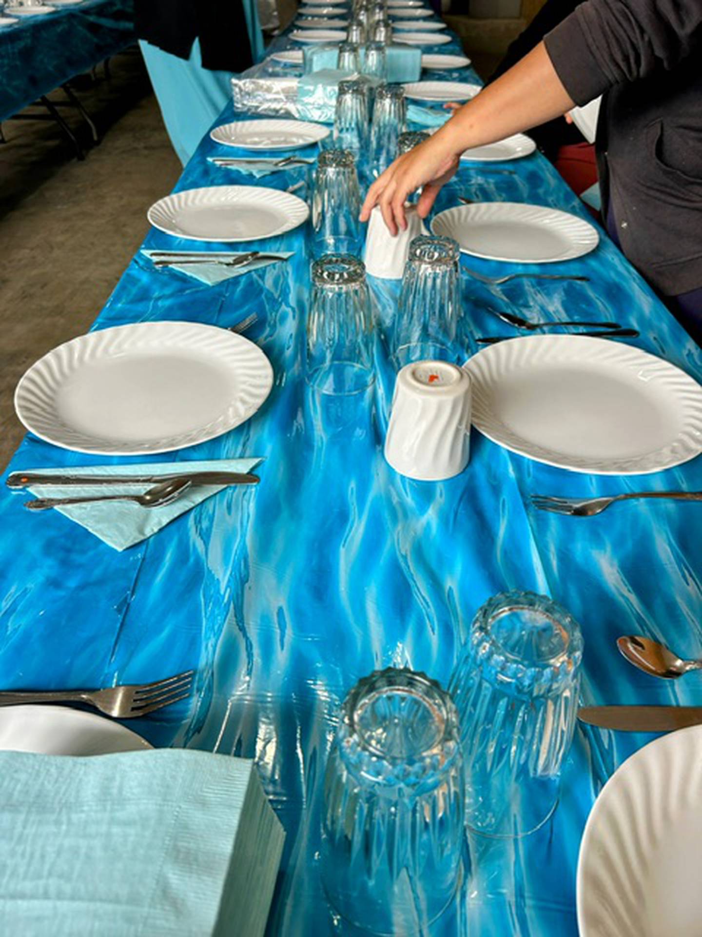 Setting the tables for Verena and Daniel Ray's wedding.