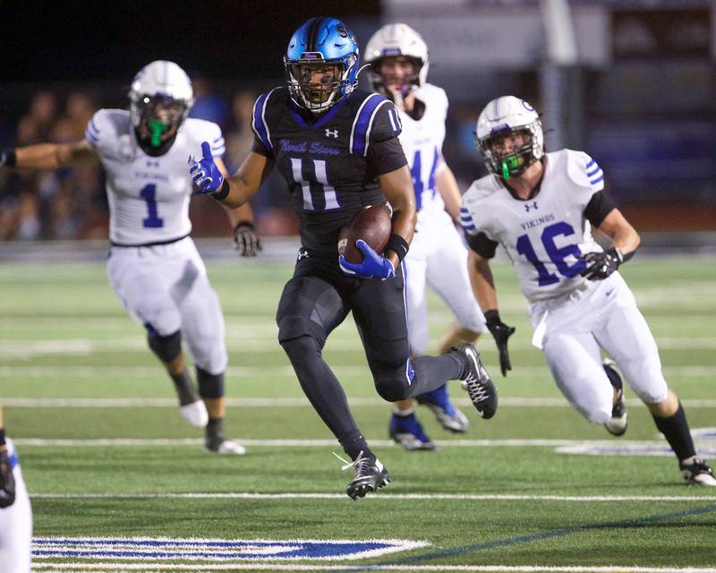 St. Charles North's Chris Akpede looks for running room against Geneva on Sept. 12, 2025 in St. Charles.