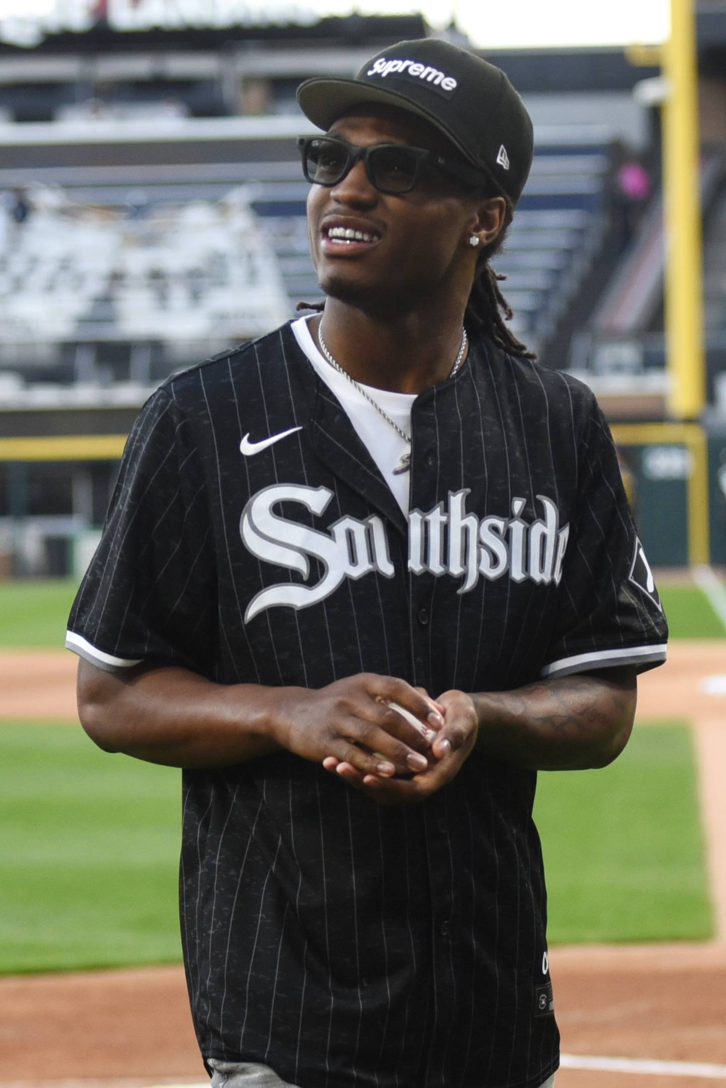 Jyaire Hill looks up towards his friends and family in the crowd after throwing the ceremonial first pitch ahead of the Chicago White Sox's home game against the Milwaukee Brewers at Rate Field in Chicago Tuesday, April 29, 2025.