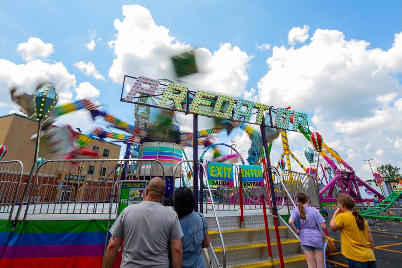 Spectators watch The Predator spin at Plainfield Fest, presented by the Plainfield Riverfront Foundation, on June 29, 2025.