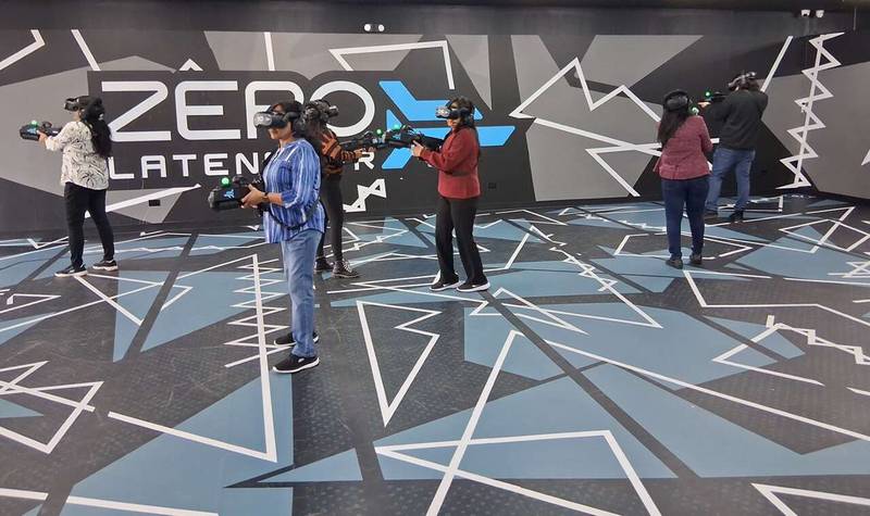 A group wearing immersive virtual-reality headsets engages in the game “Undead Arena” during a grand-opening open house Friday at Zero Latency Schaumburg, 309 W. Golf Road in Schaumburg.