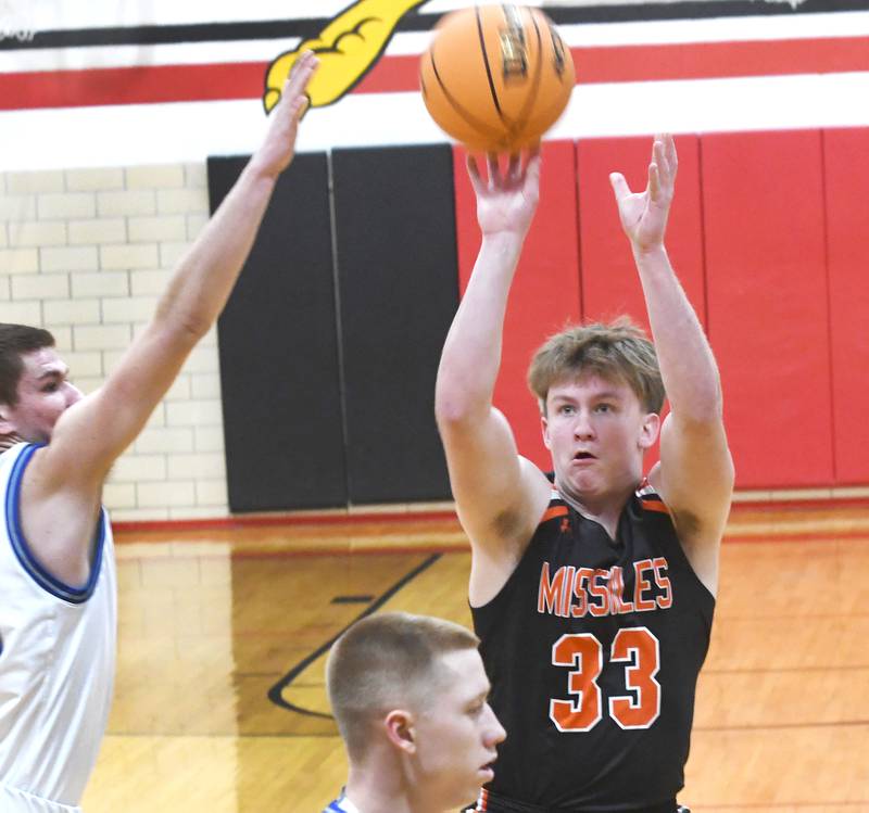 Milledgeville's Karter Livengood (33) shoots against Sterling Newman on Saturday, Dec. 13, 2025 at the 64th Annual Forreston Holiday Basketball Tournament at Forreston High School.